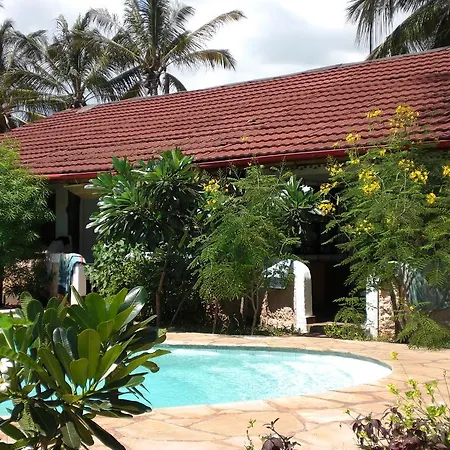 Frangipani Cottages Diani Beach Exterior photo