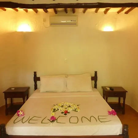 Frangipani Cottages Diani Beach Exterior photo